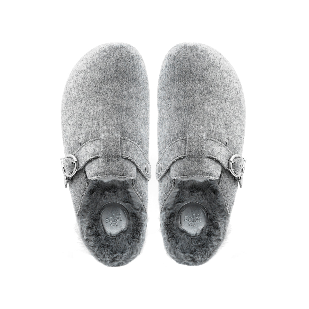 A pair of gray felt clogs with dark gray faux fur lining and silver buckle straps, shown from a top-down view on a white background.