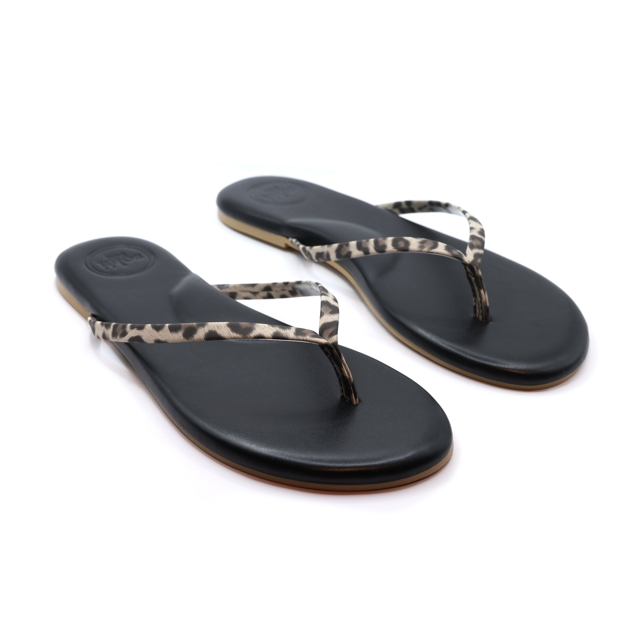 Indie Flip Flop Sandal for women with black footbed and leopard print thin straps. Arch support and rubber outsole for ultimate comfort and style